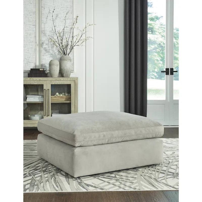 Pouf accentato in similpelle nabuk oversize con cuscino in piuma sintetica