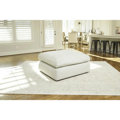 Pouf accentato in similpelle nabuk oversize con cuscino in piuma sintetica