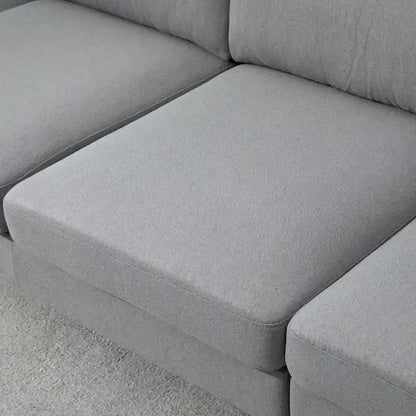 Divano sezionale a L con chaise longue reversibile, tessuto in lino e gambe in legno